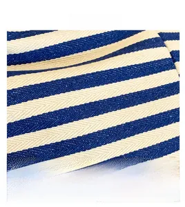 Macro shot of blue and white striped herringbone canvas fabric detail for tote bags