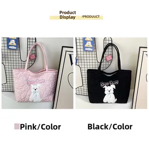 Detailed quilted heart texture and puppy embroidery on pink and black tote bags