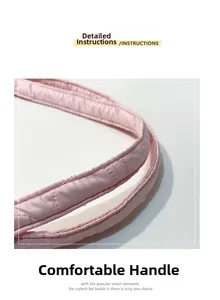 Detailed macro view of the padded pink quilted tote bag with reinforced stitching handles
