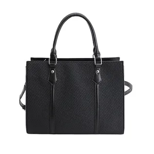 Chic black textured tote bag with silver hardware for elegant office and daily commuting