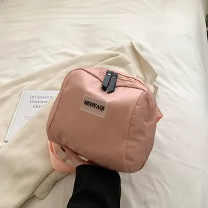 Pink PU leather portable makeup bag with zipper and shoulder strap for women travel