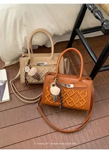Detail of retro quilted crossbody bags with GA embroidery and plush ice cream charms