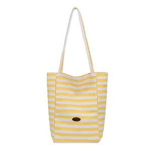 Large capacity striped canvas tote bag with yellow and white horizontal stripes and shoulder strap