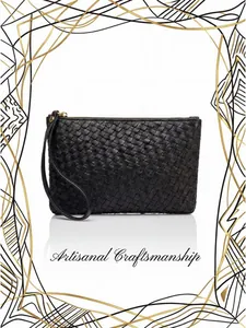 Detail of black woven leather long wallet with wristlet strap and gold zipper