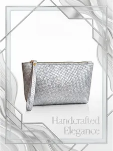 Close-up of a silver woven clutch bag featuring intricate handcrafted metallic texture