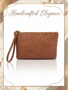 Detailed view of dark brown woven leather clutch with handcrafted elegance and metal zipper