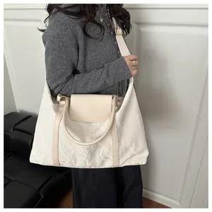 Off-white large capacity travel tote bag with pleated texture and adjustable shoulder strap