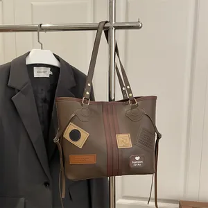 Retro brown PU leather tote bag with stylish patches and large capacity for daily commuting