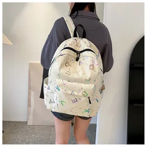 Detailed back view of a white leather backpack featuring holographic letter prints and splatter