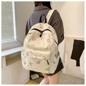 Detail of off-white backpack featuring colorful splatter print and 3D colorful letters