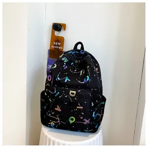 Detail of colorful letter prints and street style patterns on the black canvas backpack