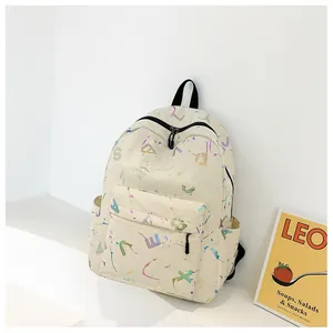 Detail of beige printed PU leather backpack with colorful graffiti and side pockets