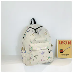 Detail of cream backpack featuring colorful laser letter prints and side water bottle pocket