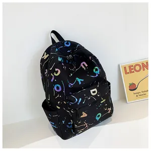 Close-up of black backpack with rainbow letter print and durable canvas texture details