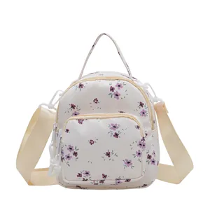 Mini zaino floreale da donna color crema con fiori viola e spalline regolabili