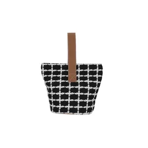 Large capacity black and white checkered tote bag with a brown leather handle