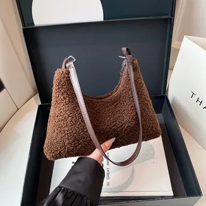 Brown fluffy teddy tote bag in a luxury gift box with a leather shoulder strap