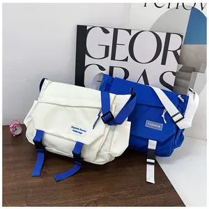 Close-up of industrial style nylon messenger bags with flap buckle and side pockets