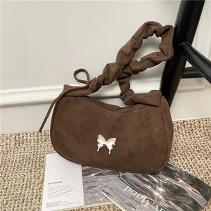 Brown faux suede crescent bag with silver butterfly and scrunchie shoulder strap