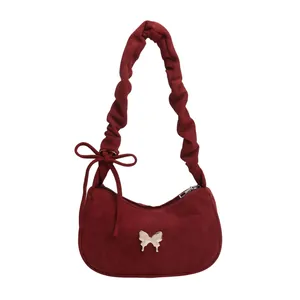 Winter burgundy suede crescent underarm bag with metal butterfly and ruched shoulder strap