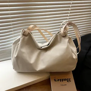 Retro large cream shoulder bag in soft leather with adjustable strap and gold hardware