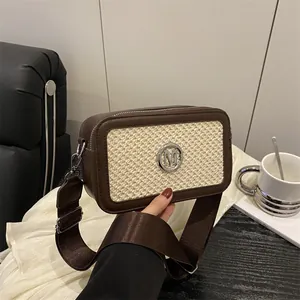 Winter 2025 brown leather and straw crossbody bag with silver M logo and wide strap