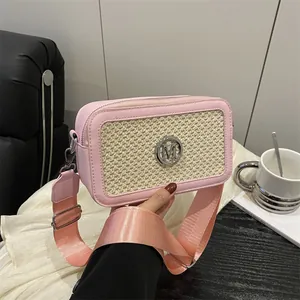 Pink fashion crossbody bag with woven texture, metal M logo and wide shoulder strap