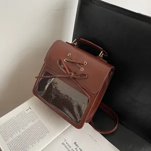 Brown vintage PU leather ita bag with large transparent window and bow decoration