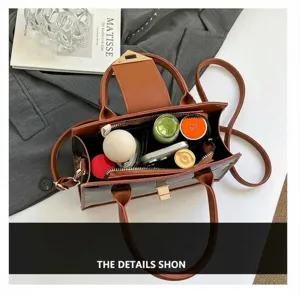 Top view of two-tone crossbody bag interior capacity with phone and cosmetics