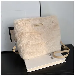 Detailed close-up of plush faux fur texture and PU leather strap on beige shoulder bag