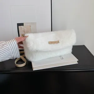 Elegant white faux fur flap shoulder bag with soft texture and slim strap for autumn winter