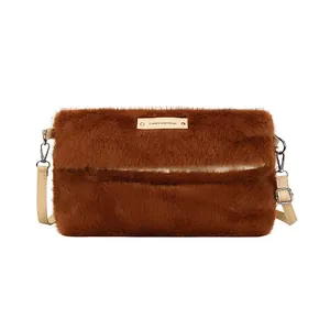 Brown fluffy faux fur crossbody bag with adjustable strap and designer metal nameplate