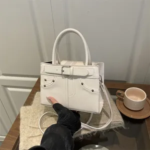 Minimalist off-white crossbody tote bag with chain strap and belt buckle design