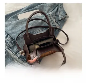 Interior view of cat-themed crossbody bag showing spacious compartments and storage capacity