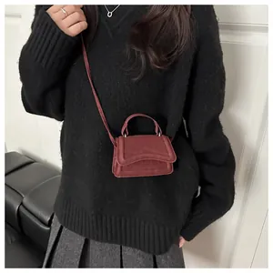 Micro vintage burgundy crossbody bag with flap and top handle for trendy outfits