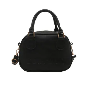 Classic black oil leather shell handbag with gold hardware and embossed COIH-2DN lettering