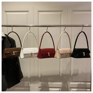Row of colorful glossy faux leather baguette bags with golden U-shaped buckles