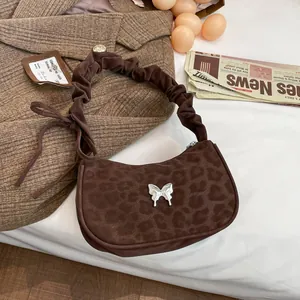 Brown leopard print crescent underarm bag with silver butterfly and pleated strap