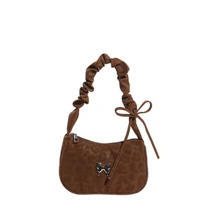 Vintage leopard print underarm bag with silver butterfly buckle and pleated handle