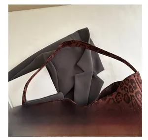 Detail showing high-quality leopard print fabric texture and comfortable shoulder strap