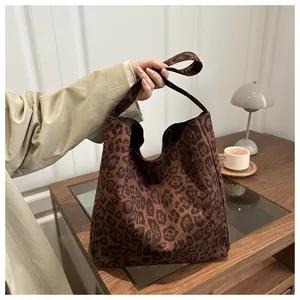Detail showing the large capacity and leopard print fabric of the vintage tote bag