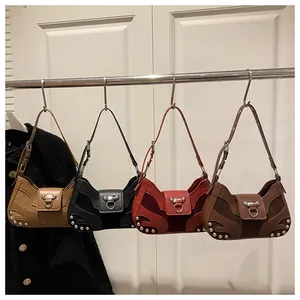 Detail of vintage hobo bags with metallic rivets and ring buckle in four retro colors
