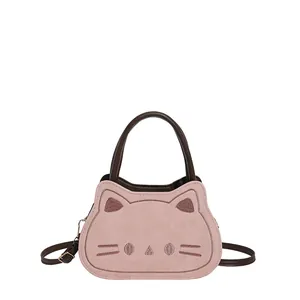 Cute pink cat-shaped crossbody bag with soft suede texture and embroidery detail