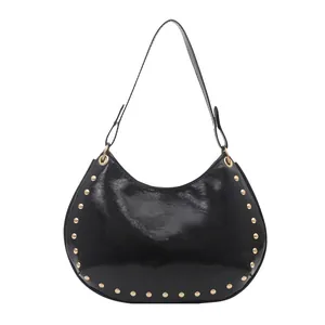 Chic black hobo shoulder bag with glossy finish and gold studded rivets for women