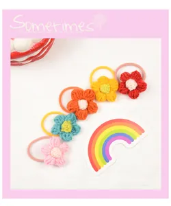 Detail of 5-piece handmade crochet flower hair ties set in assorted vibrant colors