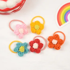 Set of 5 colorful handmade crochet flower hair ties for girls on a white background