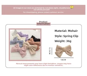 Detail view of mohair double-layer bow hair clips with spring clips in multiple pastel colors