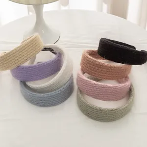 Detailed view of handmade mohair knitted headbands in eight vibrant vintage colors