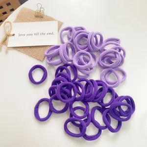 Detail of high-elastic seamless ponytail holders in lavender and violet purple hues