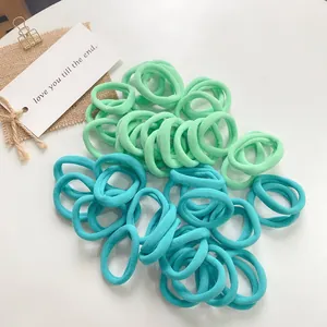 Detail of high-elastic seamless hair ties in mint green and lake blue candy colors